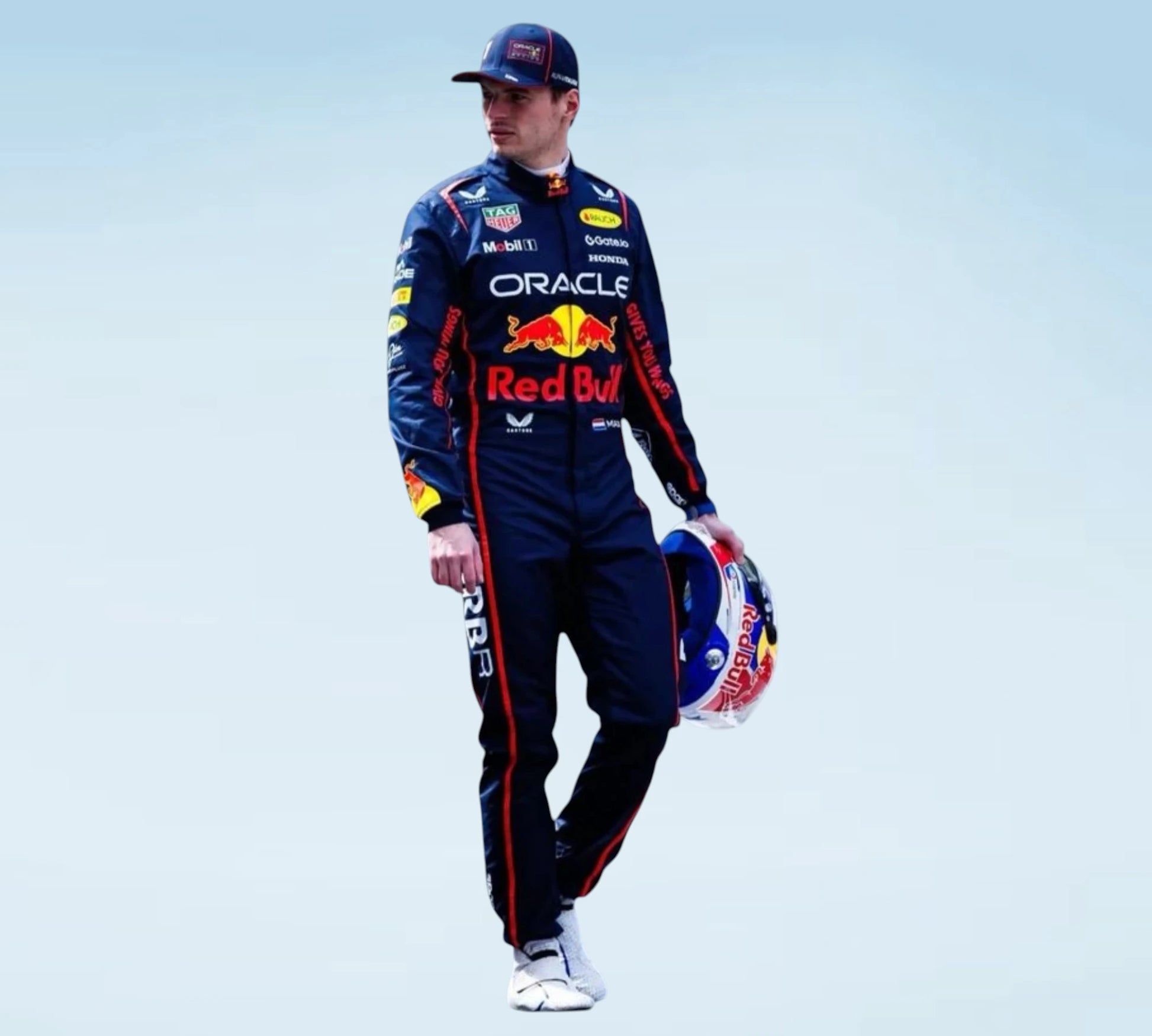 A man in a Red Bull Racing team uniform and cap holds a Red Bull helmet against a pale blue studio background.