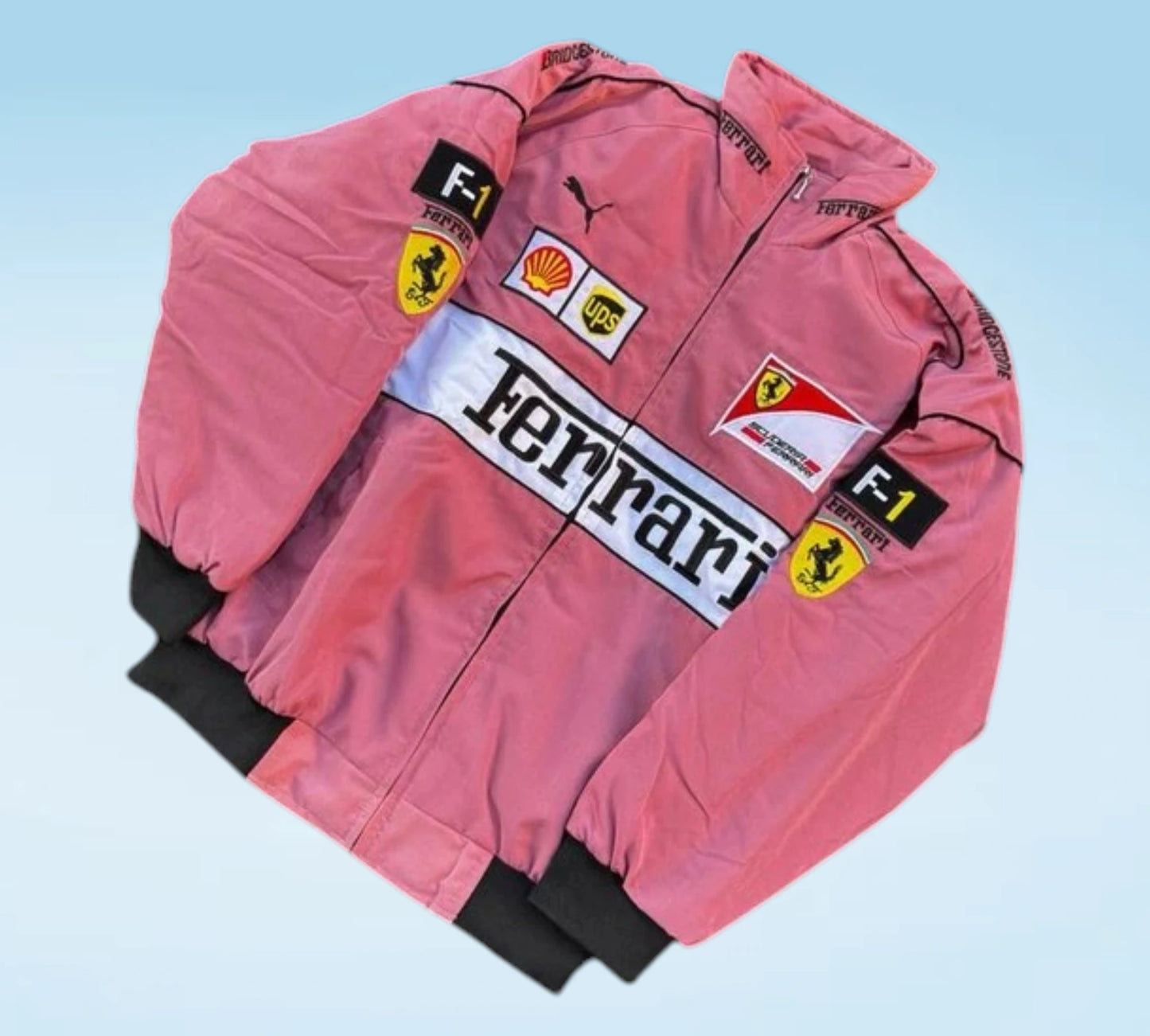 Pink racing jacket with Ferrari and F1 logos on a light blue background