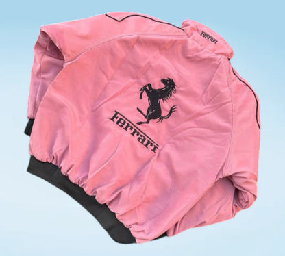 Pink Ferrari jacket with logo on a light blue background