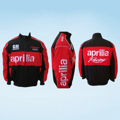 A red and black racing jacket shown from the front, back, and side views on a light blue gradient background. The jacket features 'aprilia Racing' branding in white on the chest and back, with 'GM' on the right chest and 'Racing Team' on the left chest.