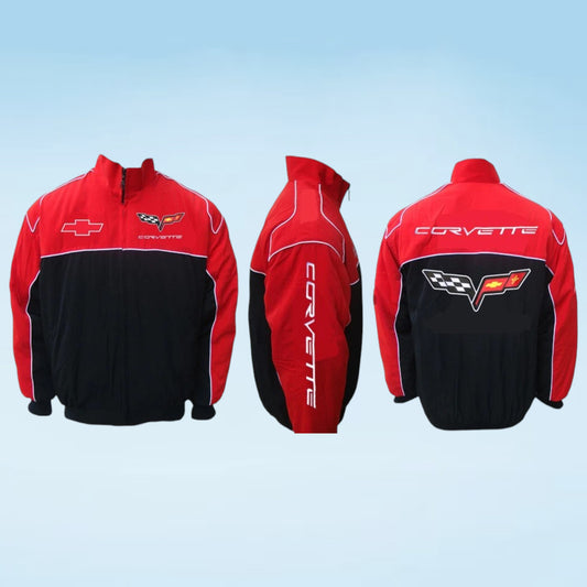 A red and black Corvette windbreaker jacket shown from the front, side, and back views against a light blue gradient background. The jacket features the Corvette logo on the chest, 'CORVETTE' printed vertically on the sleeve, and 'CORVETTE' across the back.