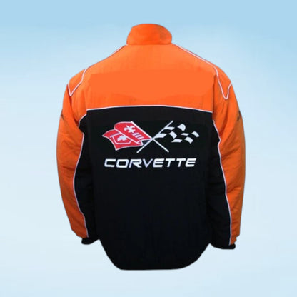 An orange and black racing jacket shown from the back, featuring a large Corvette logo with crossed checkered flags and the word 'CORVETTE' printed across the back.