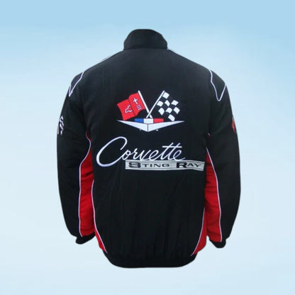 Black Corvette Sting Ray jacket shown from the back, featuring a large graphic with checkered flags, the Corvette logo, and 'Sting Ray' text, with red side panels and white piping, set against a light blue gradient background.