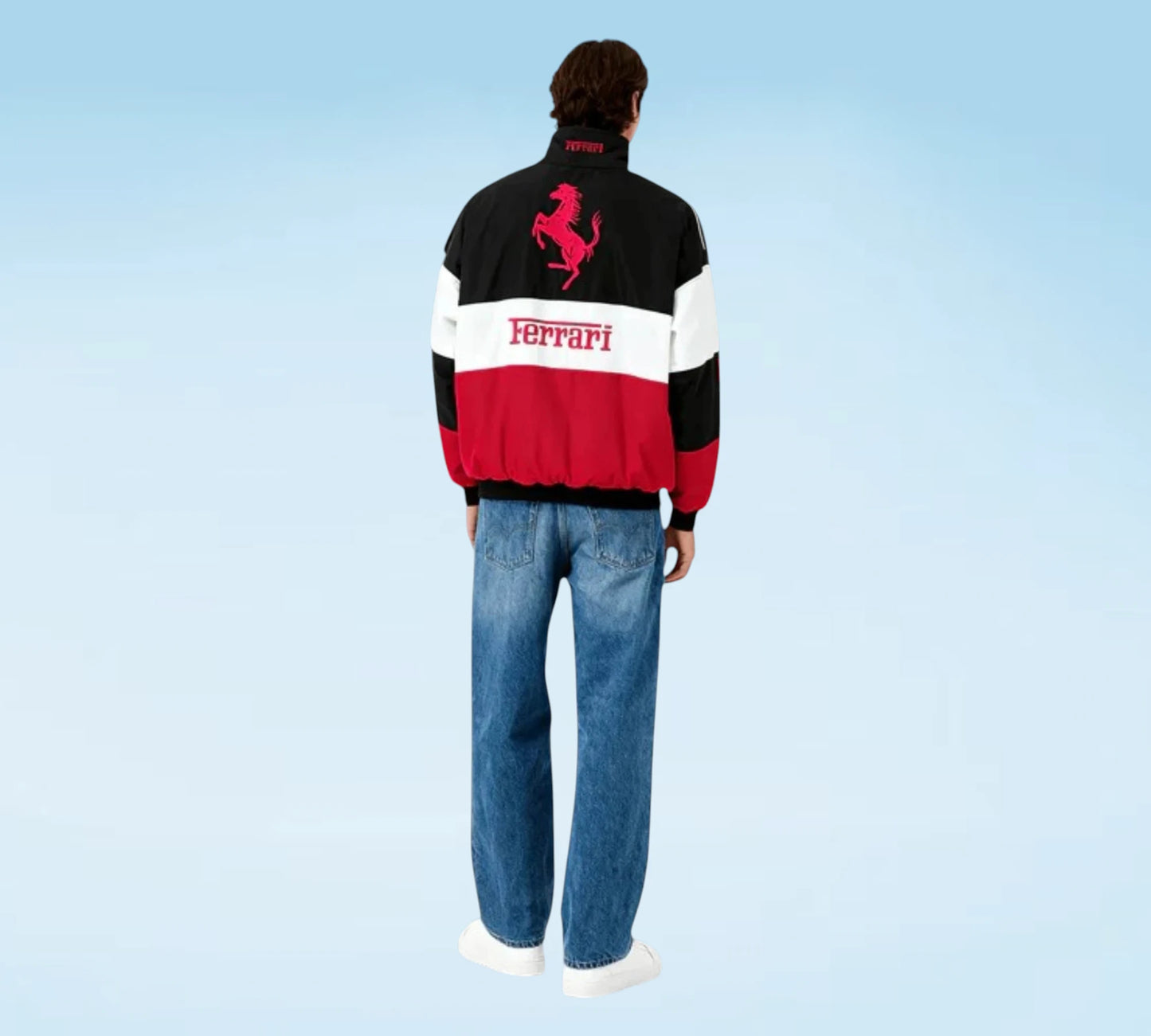 Person wearing a Ferrari jacket with a blue background