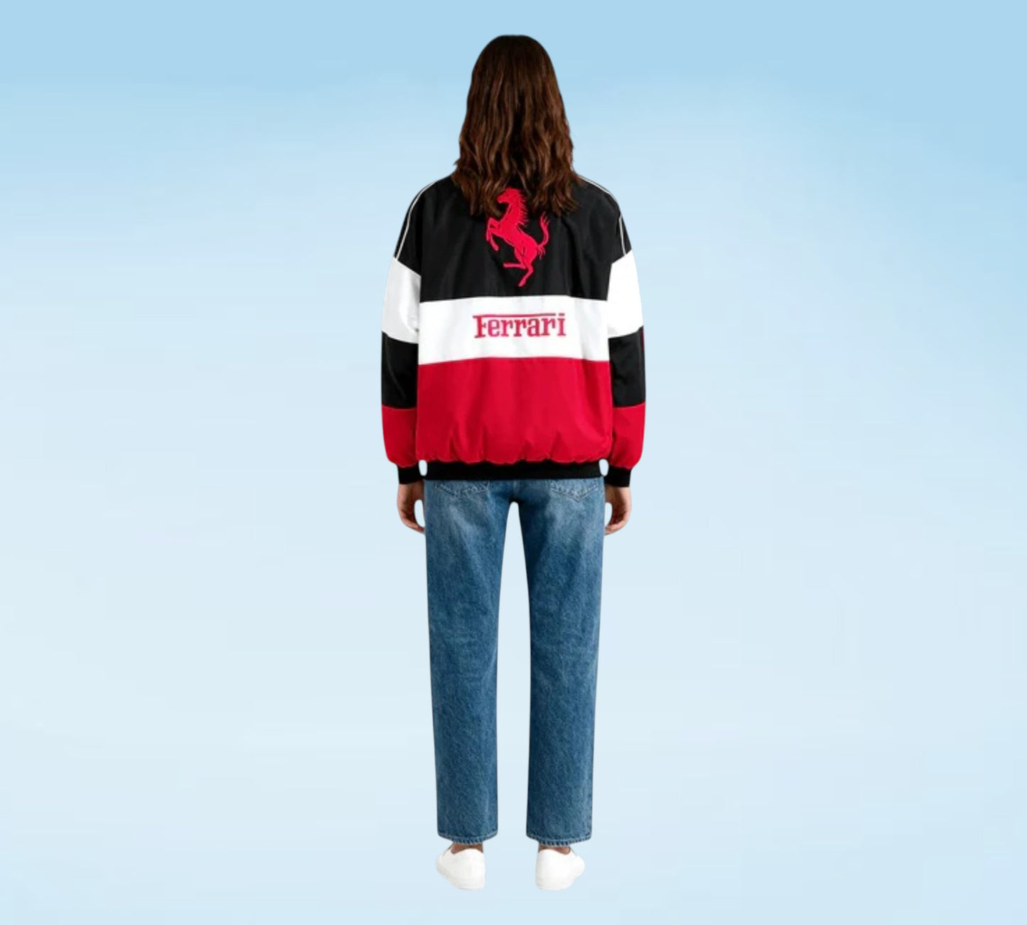 Person wearing a Ferrari-themed jacket with a blue background