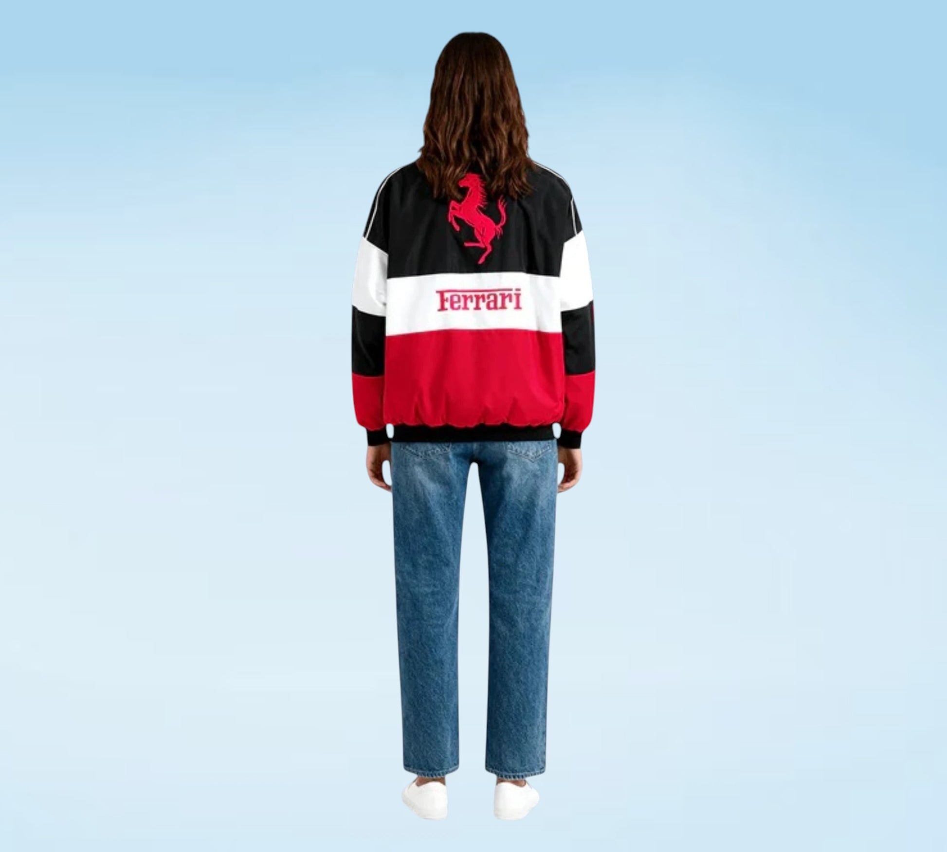 Person wearing a Ferrari-themed jacket with a blue background