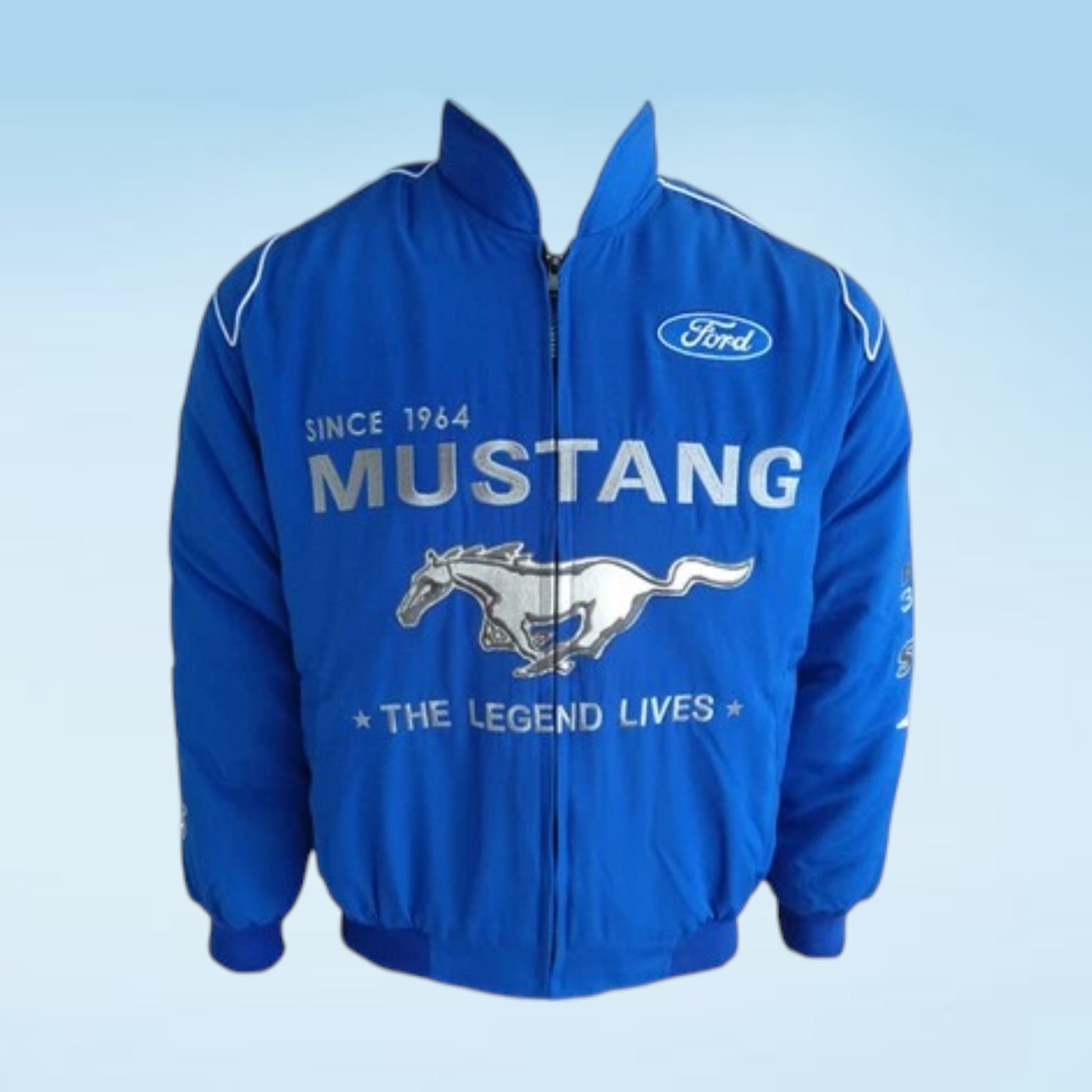 A royal blue Ford Mustang zip-up jacket with white embroidered text and graphics, including the Ford logo and the running horse emblem, shown against a light blue gradient background.