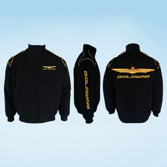 Three views of a black zip-up jacket with gold graphics: front, back, and side views. The front features a small gold wing logo with 'GOLDWING' text, the side shows vertical 'GOLDWING' text on the sleeve, and the back has a large gold wing logo and 'GOLDWING' text.