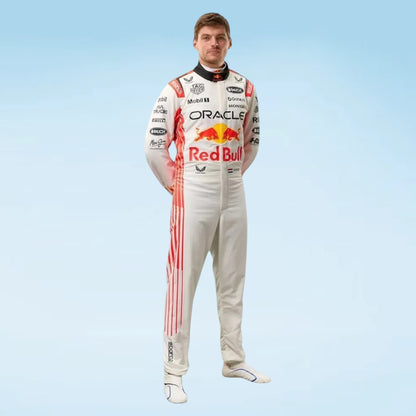 A full-body cutout of a man wearing a Red Bull Racing team racing suit, featuring a white base with red and black graphics and sponsor logos, set against a light blue gradient background.
