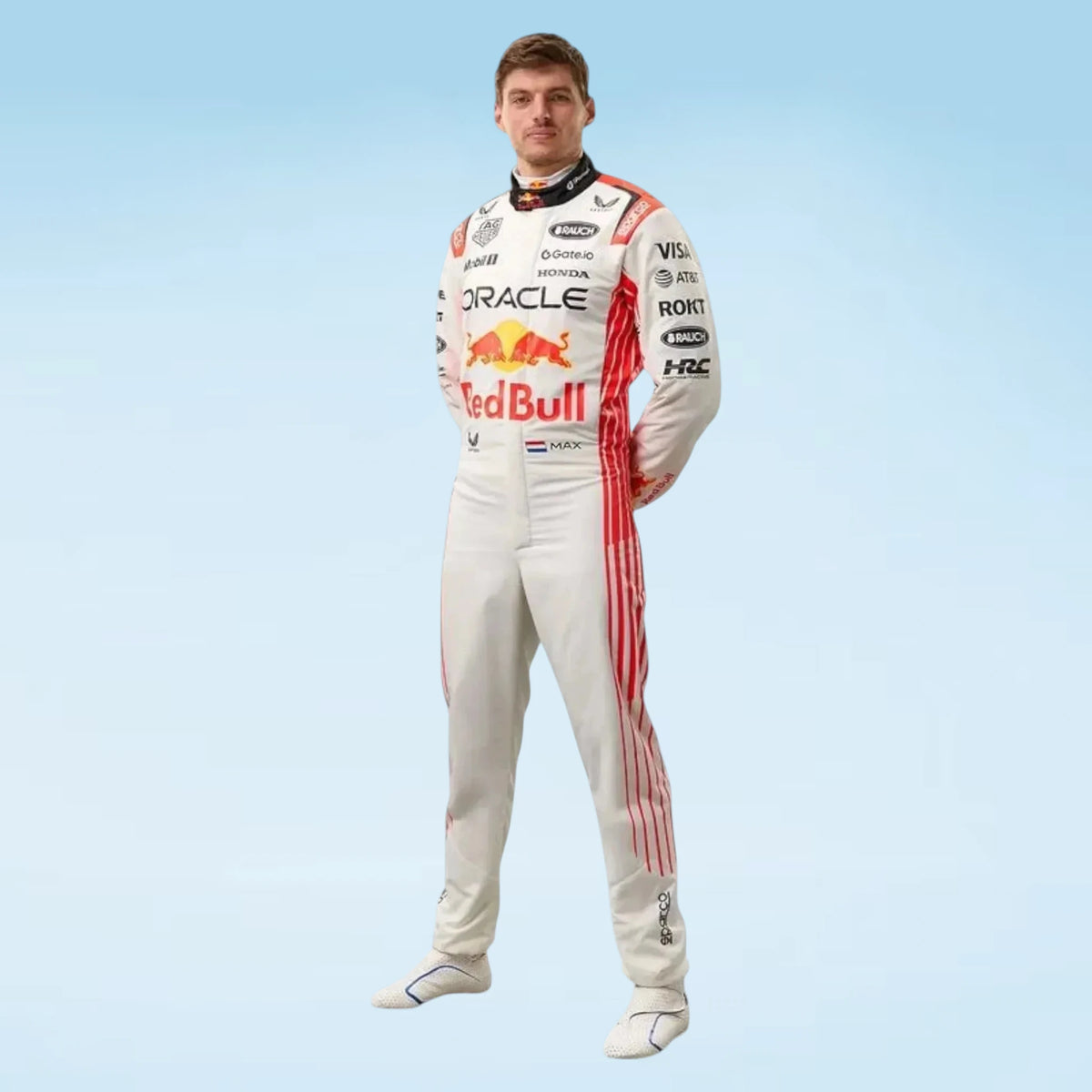 A man wearing a Red Bull Racing driver suit stands against a light blue gradient background. The white suit features red side stripes and prominent sponsor logos including Oracle, Red Bull, Castore, and Honda.