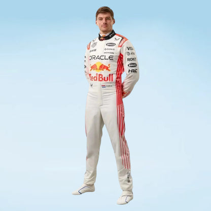 A man wearing a Red Bull Racing driver suit stands against a light blue gradient background. The white suit features red side stripes and prominent sponsor logos including Oracle, Red Bull, Castore, and Honda.