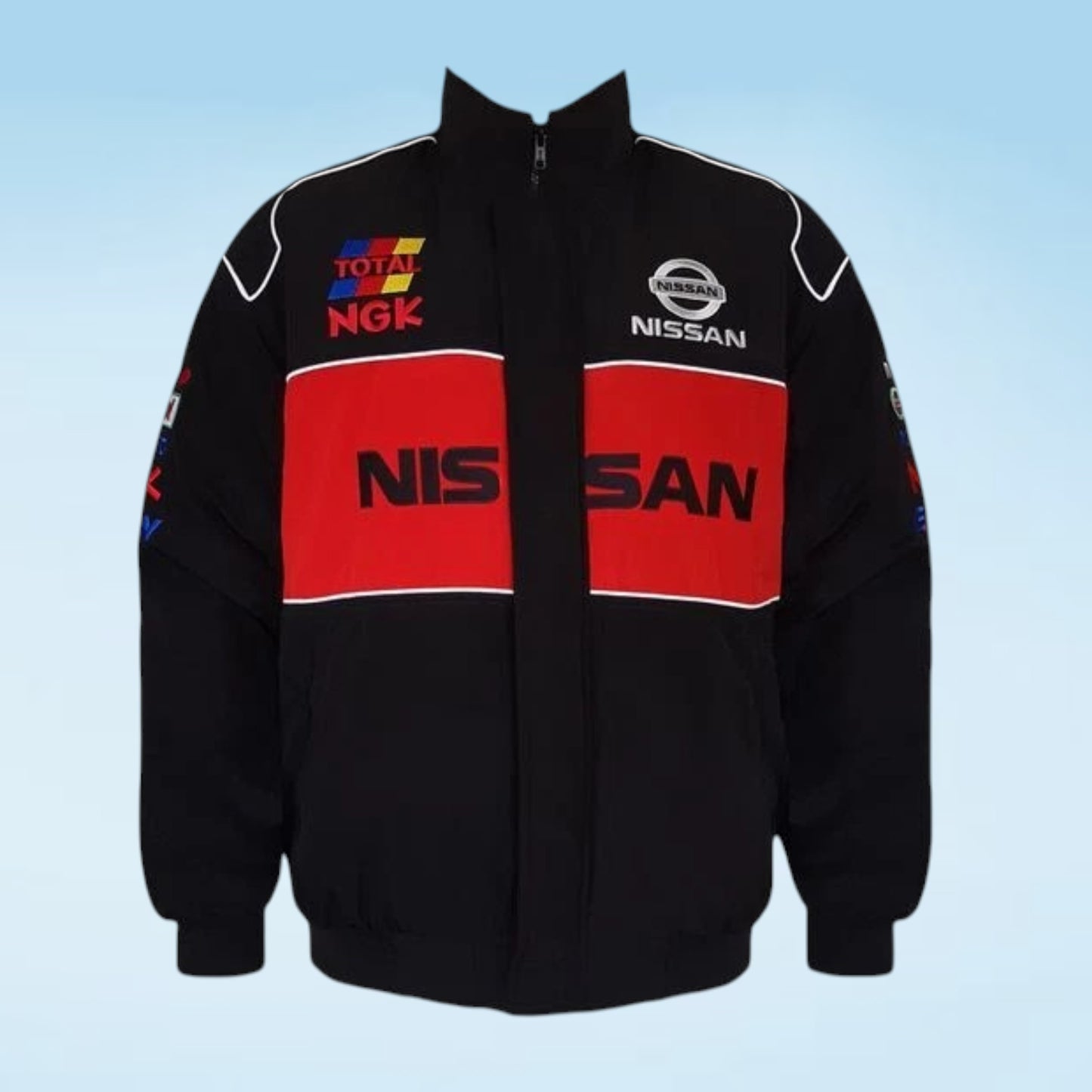 A black zip-up racing jacket with bold red chest panels and white piping, featuring visible Nissan and Total NGK logos on the front against a light blue gradient background.