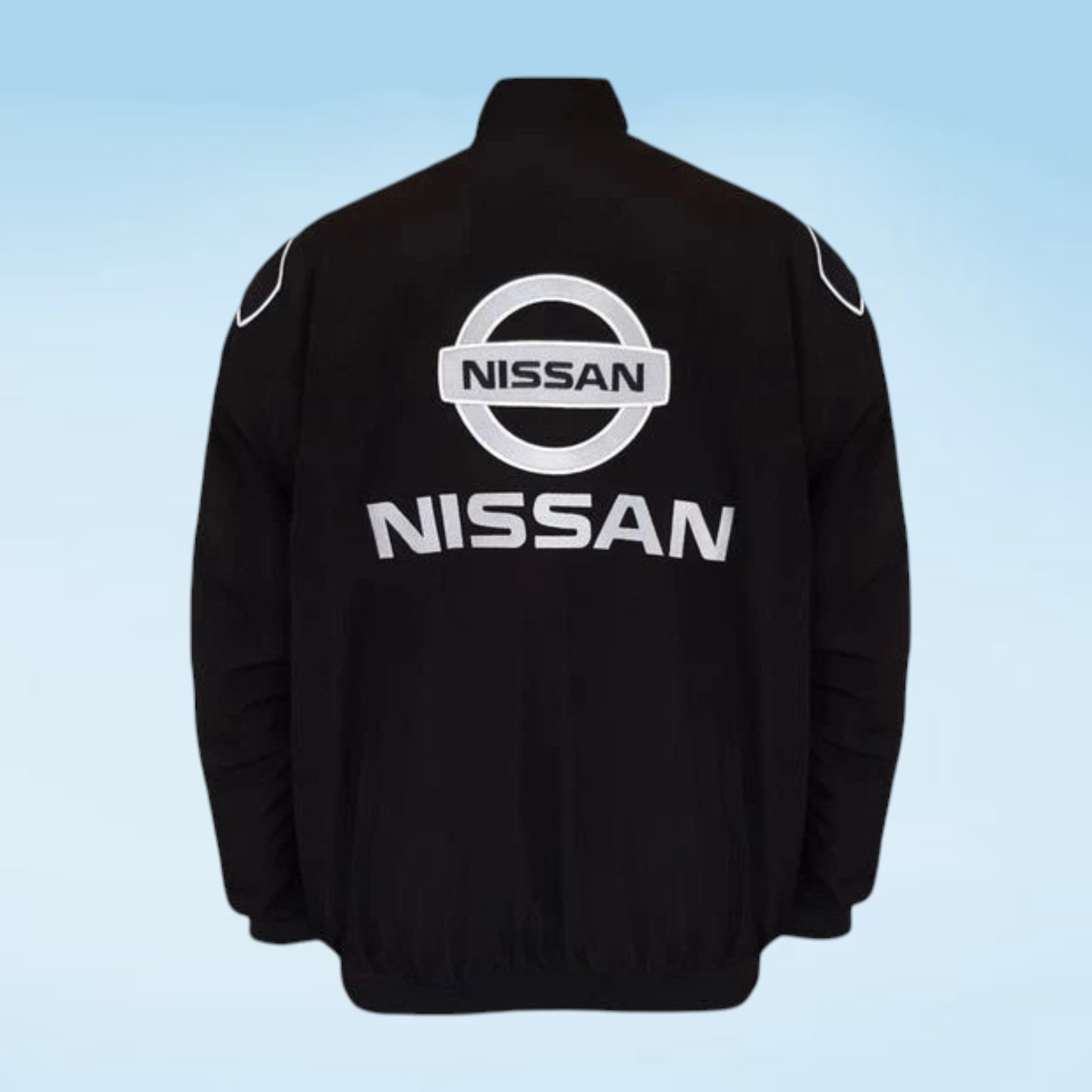 A black Nissan jacket shown from the back, featuring a large white and silver Nissan logo and wordmark on the back, with white circular patches on the shoulders, set against a light blue gradient background.