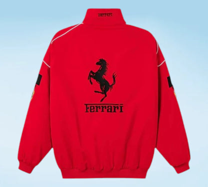 Red Ferrari jacket with black logo on a light blue background